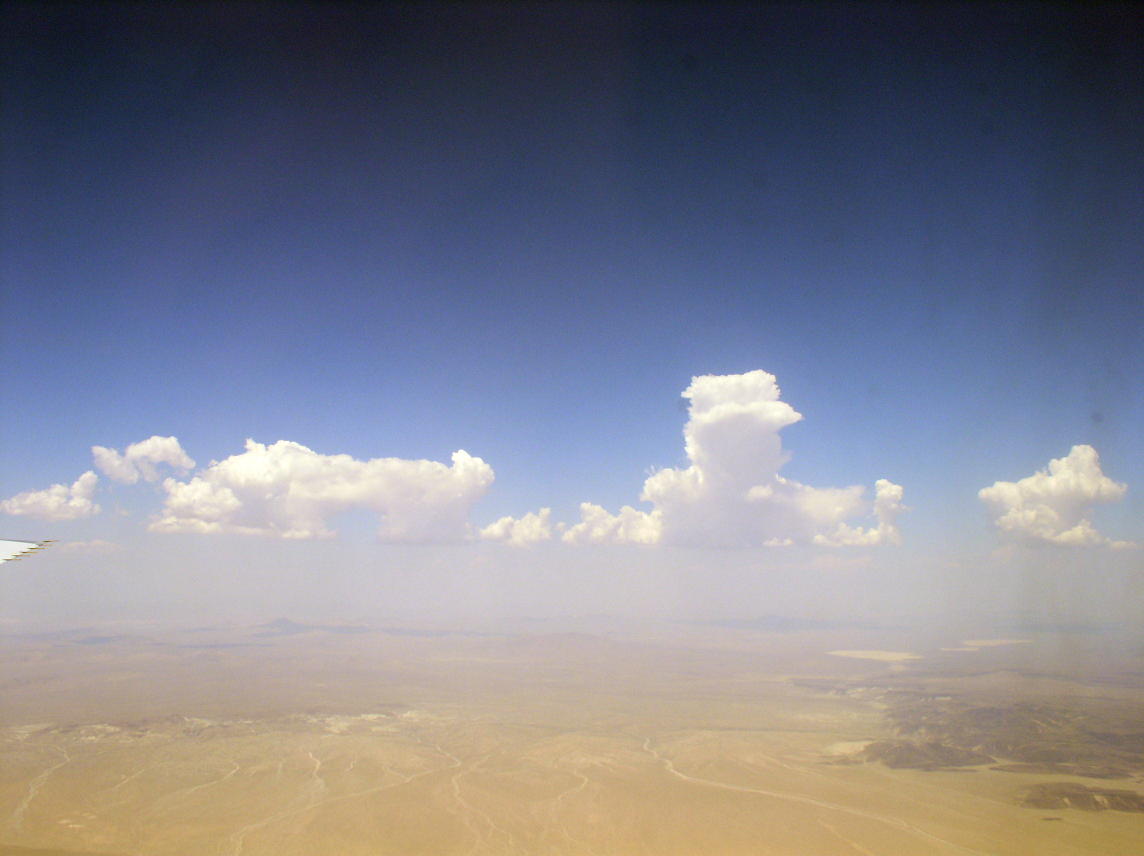 Towering cloud over desert